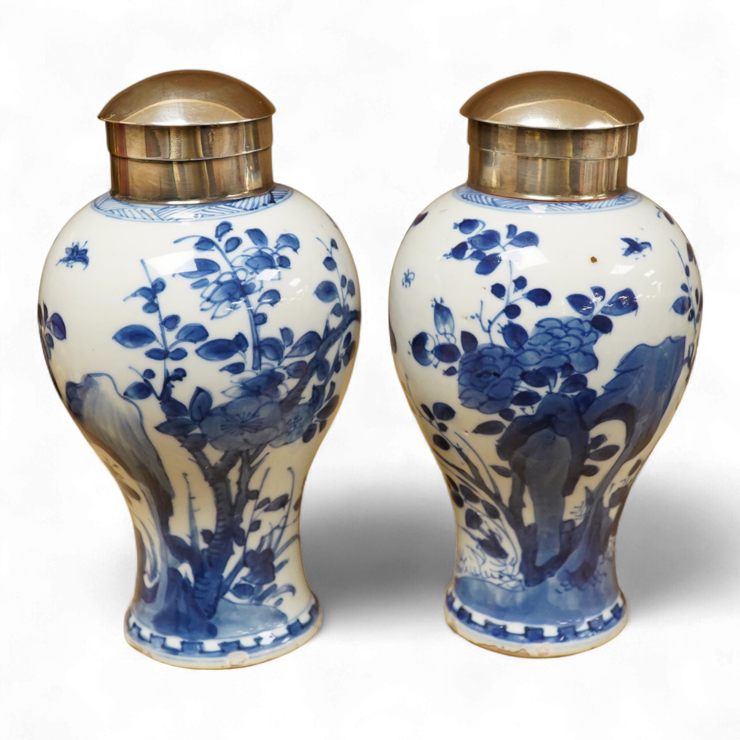A pair of Chinese white metal mounted blue and white vases, Kangxi period (1662-1722), 16.5cm